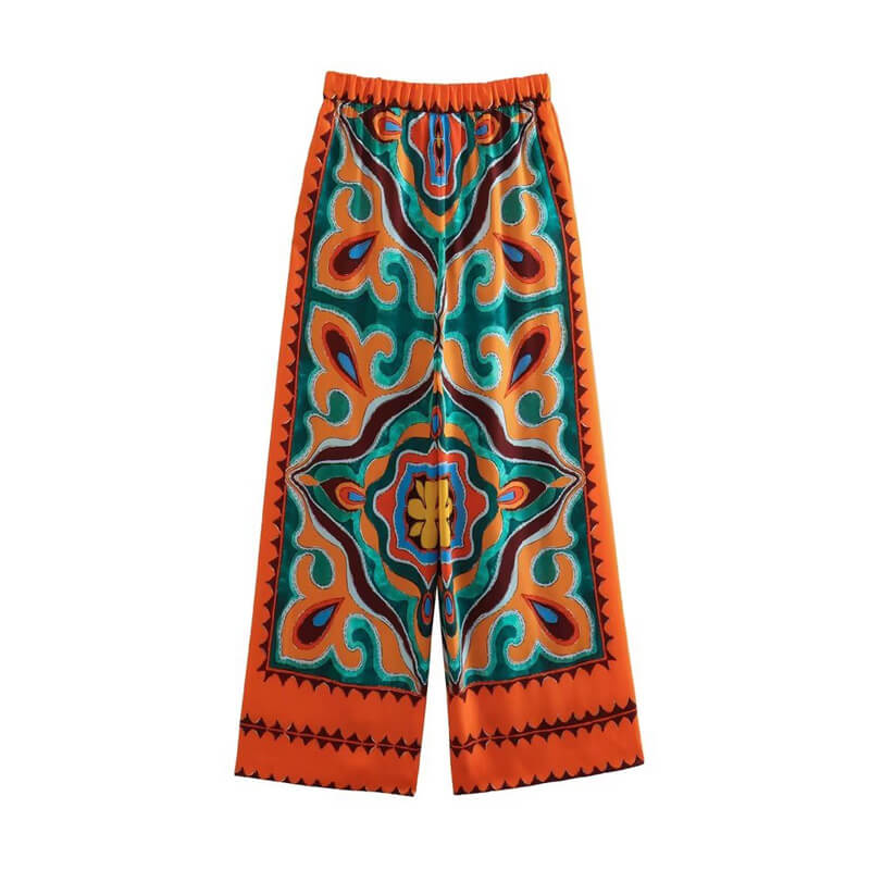 Pantalon en satin orange aux motifs colorés