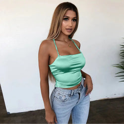 Top en satin vert et dos nu